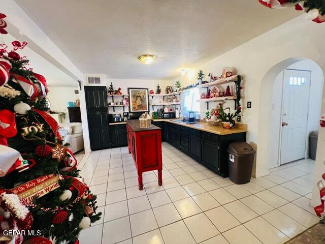 kitchen with light tile patterned floors and a center island