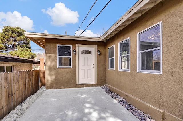 entrance to property with a patio area