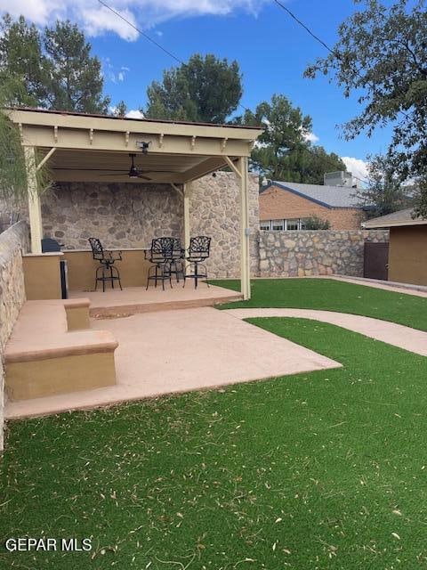 view of patio featuring ceiling fan