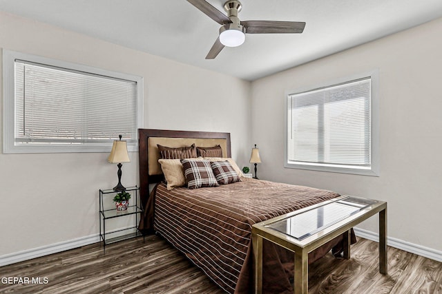 bedroom featuring dark hardwood / wood-style floors and ceiling fan