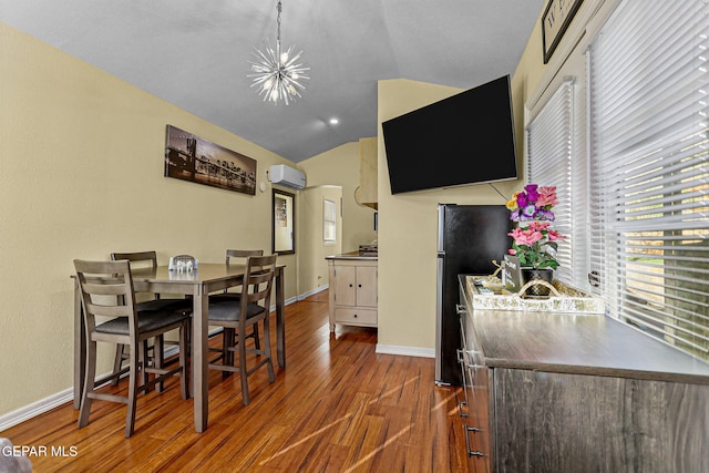 dining space featuring a wall unit AC, dark hardwood / wood-style flooring, vaulted ceiling, and a notable chandelier