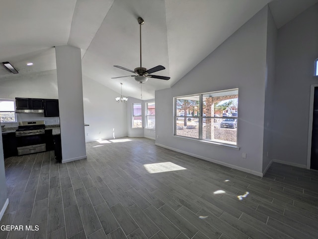 living room featuring high vaulted ceiling and ceiling fan with notable chandelier