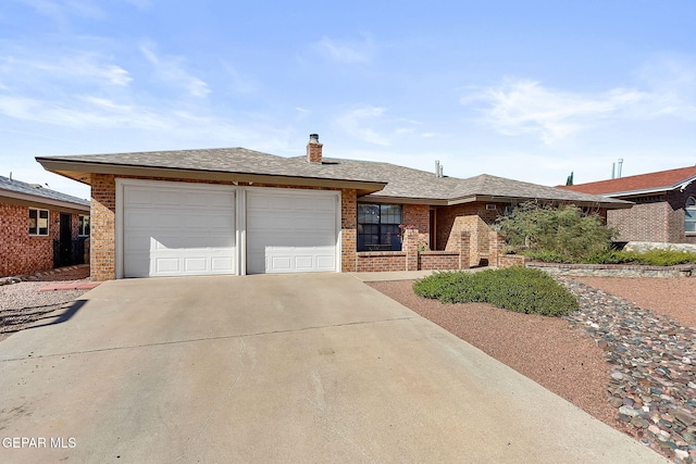 ranch-style home with a garage