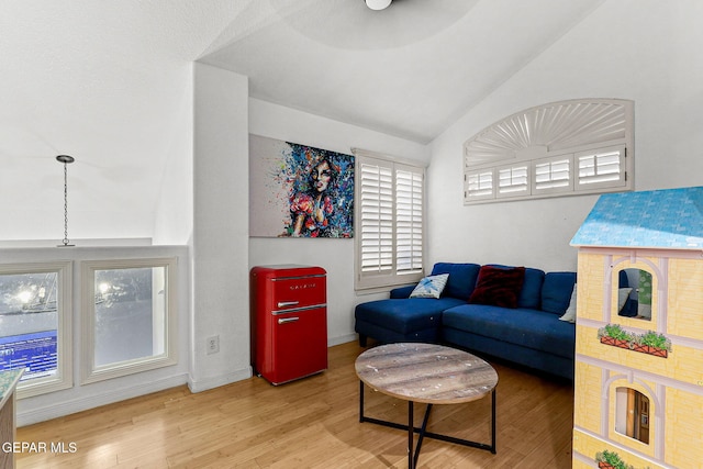 12196 Dos Rios Dr, El Paso, TX 79936 - living room featuring hardwood / wood-style floors and vaulted ceiling