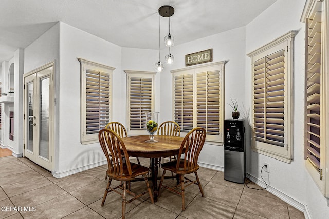 12196 Dos Rios Dr, El Paso, TX 79936 - tiled dining space with french doors