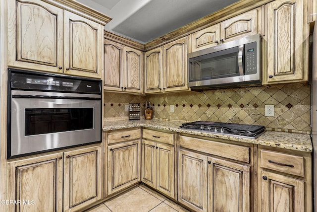 12196 Dos Rios Dr, El Paso, TX 79936 - kitchen featuring light stone countertops, decorative backsplash, light tile patterned flooring, and stainless steel appliances