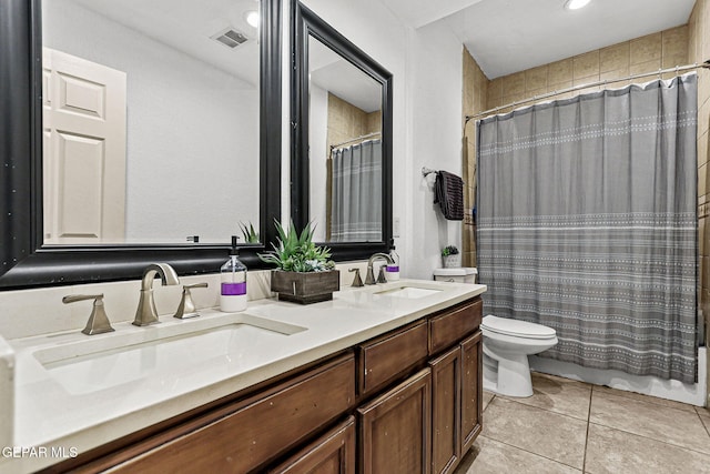 12196 Dos Rios Dr, El Paso, TX 79936 - full bathroom with vanity, shower / bath combo, tile patterned flooring, and toilet