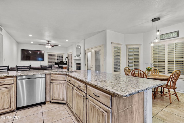 12196 Dos Rios Dr, El Paso, TX 79936 - kitchen featuring light tile patterned floors, pendant lighting, sink, dishwasher, and ceiling fan