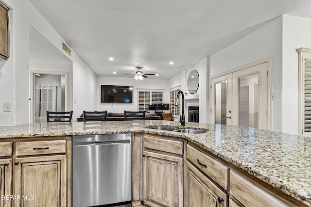 12196 Dos Rios Dr, El Paso, TX 79936 - kitchen with dishwasher, light stone countertops, sink, and ceiling fan