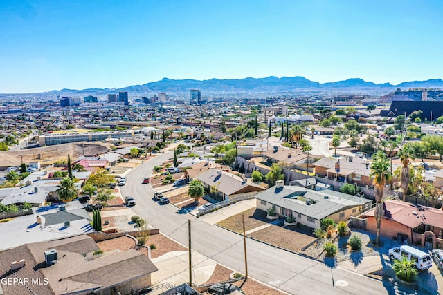 birds eye view of property featuring a mountain view