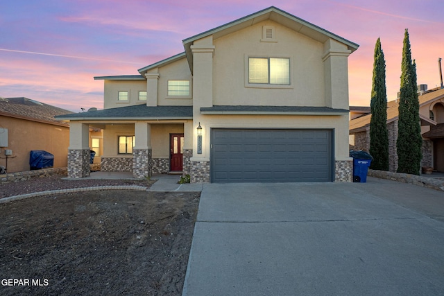 front facade with a garage