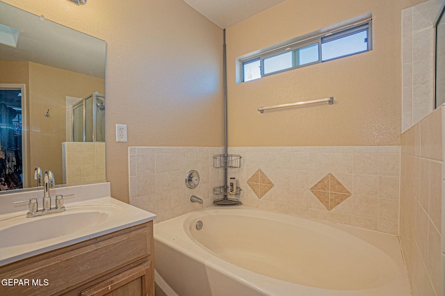 bathroom featuring vanity and separate shower and tub