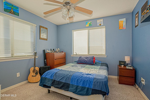 bedroom featuring ceiling fan and carpet flooring