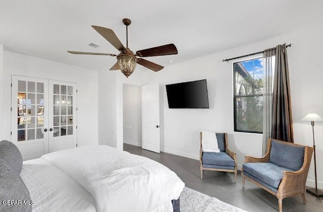 bedroom with ceiling fan and french doors