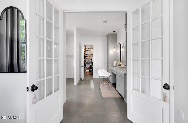 bathroom featuring concrete flooring