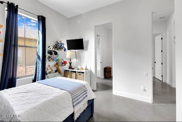 bedroom with concrete flooring