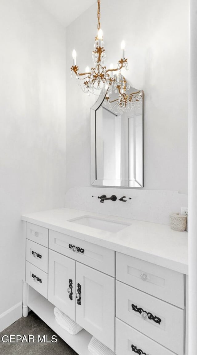 bathroom featuring vanity and an inviting chandelier