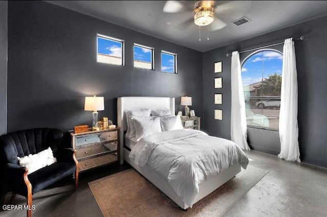 bedroom with concrete flooring and ceiling fan