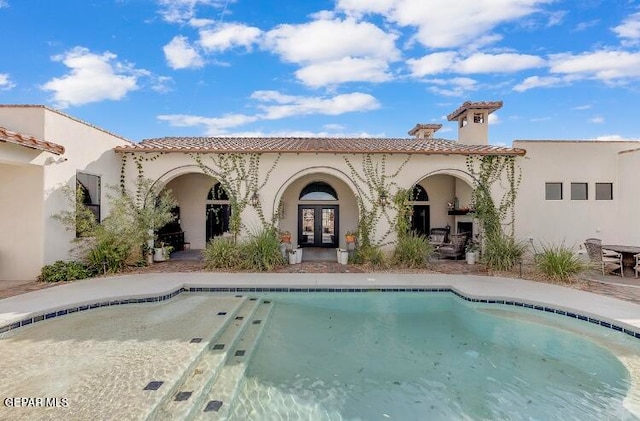 back of house featuring french doors and a patio area