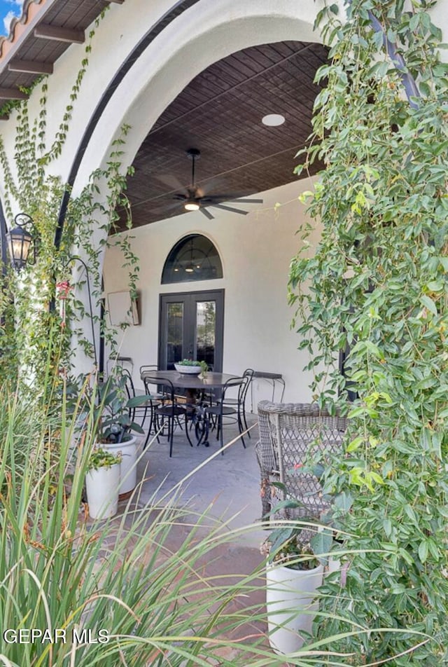 view of patio featuring french doors and ceiling fan