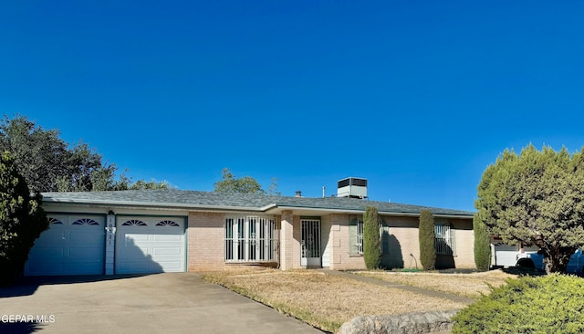 ranch-style home featuring a garage