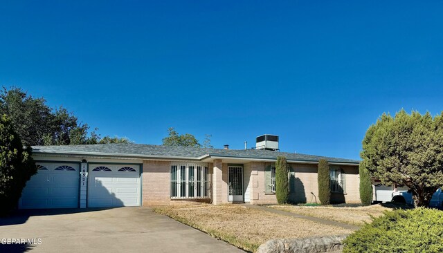10521 Gaius Dr, El Paso, TX 79924 - ranch-style home featuring an attached garage, driveway, and brick siding