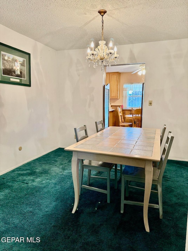 unfurnished dining area featuring a textured ceiling, dark colored carpet, and ceiling fan with notable chandelier