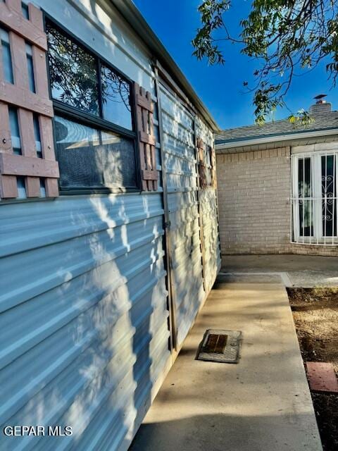 view of side of property with a patio area