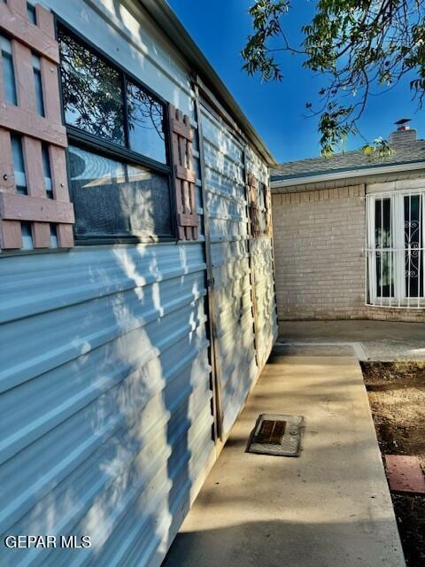 10521 Gaius Dr, El Paso, TX 79924 - view of property exterior featuring brick siding and a chimney