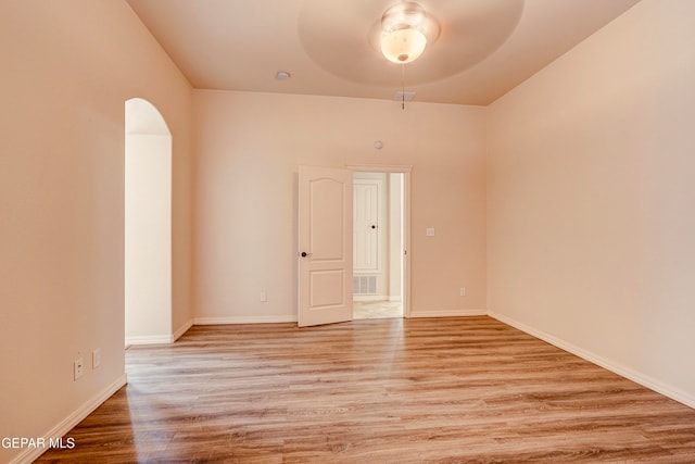 spare room featuring ceiling fan and light wood-type flooring