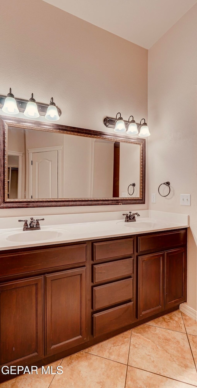 bathroom featuring tile patterned floors and vanity