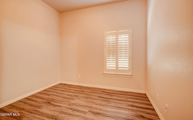 empty room featuring hardwood / wood-style flooring