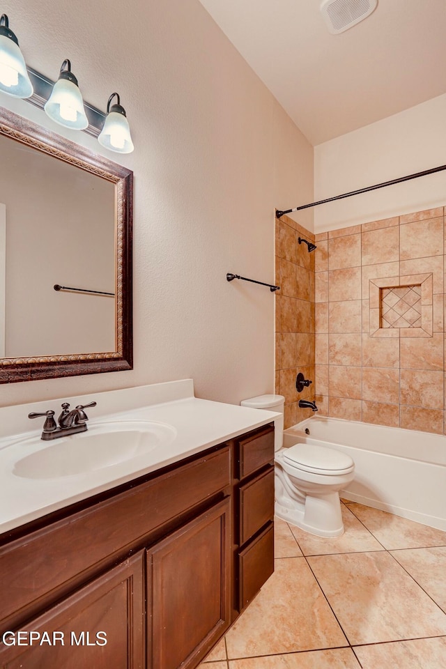 full bathroom with tile patterned floors, vanity, toilet, and tiled shower / bath