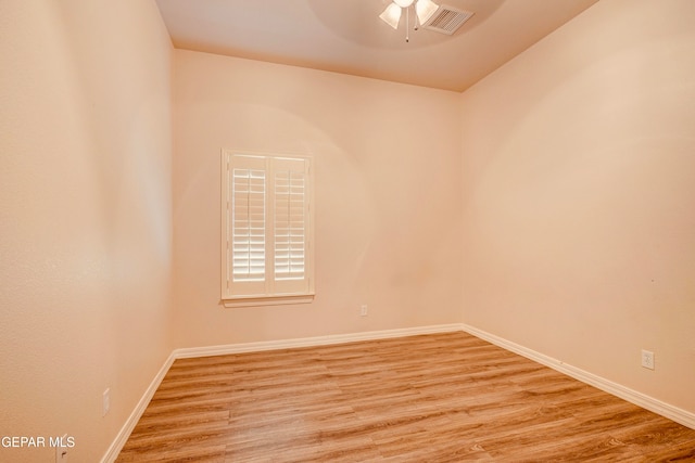 spare room featuring light hardwood / wood-style flooring and ceiling fan