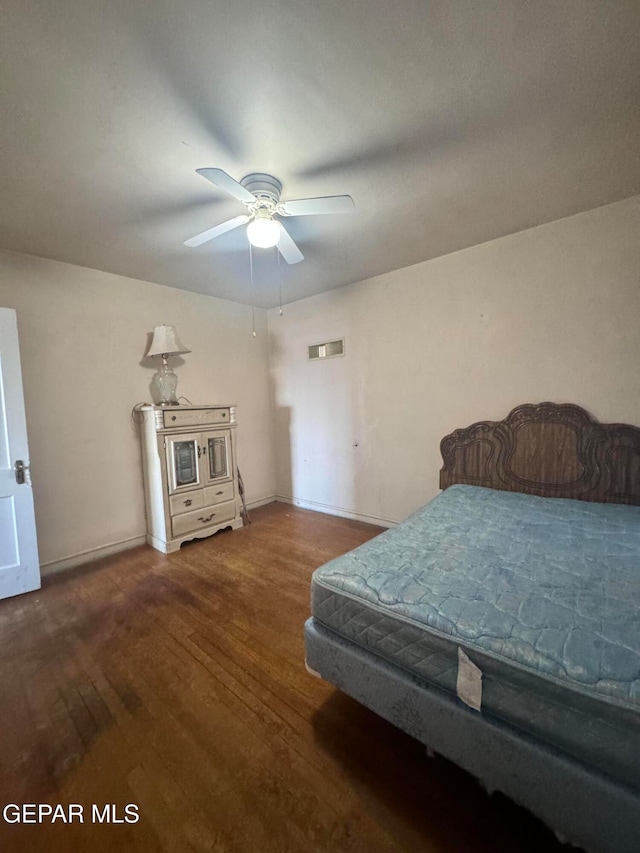 bedroom featuring wood-type flooring and ceiling fan