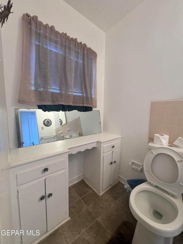 bathroom featuring tile patterned flooring and toilet