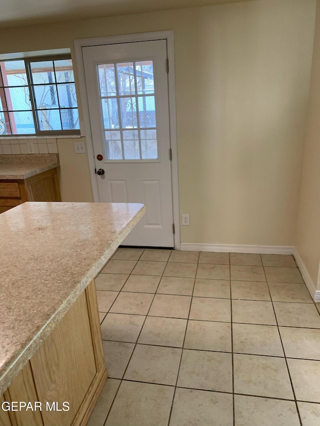 entryway featuring light tile patterned floors