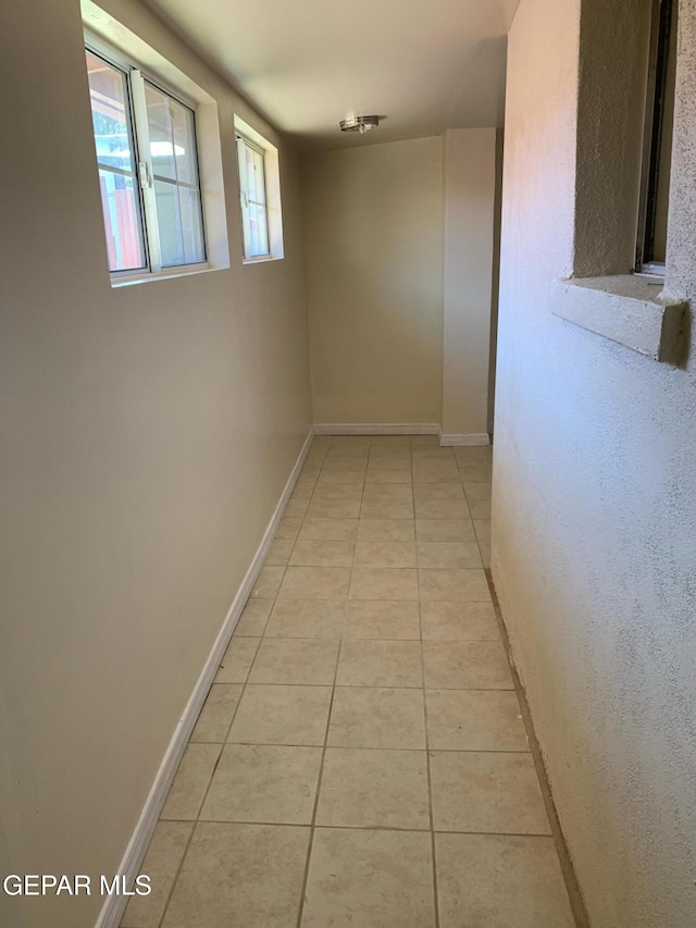 hallway featuring light tile patterned floors