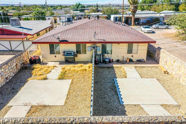 7120-7122 Second St, Canutillo, TX 79835 - back of house with stucco siding, a shingled roof, a patio area, and a fenced backyard
