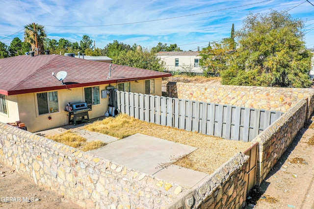 7120-7122 Second St, Canutillo, TX 79835 - view of front of home with a fenced backyard, stucco siding, and a shingled roof