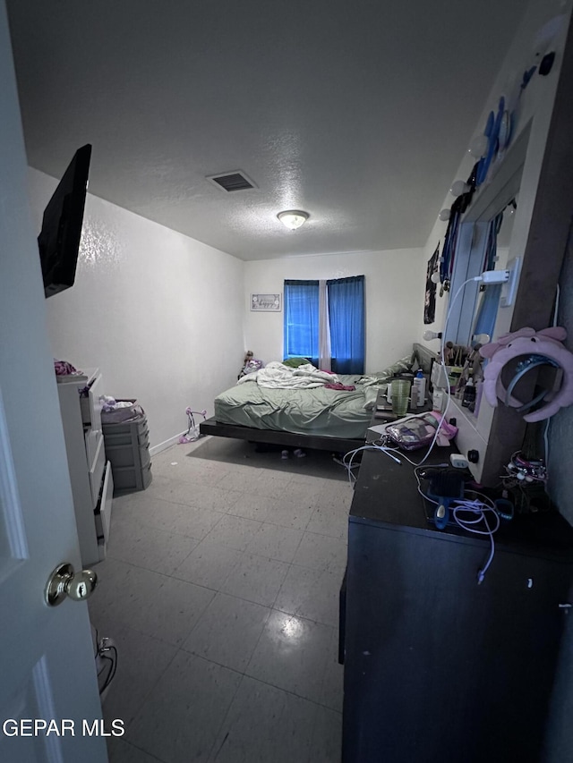 7120-7122 Second St, Canutillo, TX 79835 - bedroom with tile patterned floors and a textured ceiling
