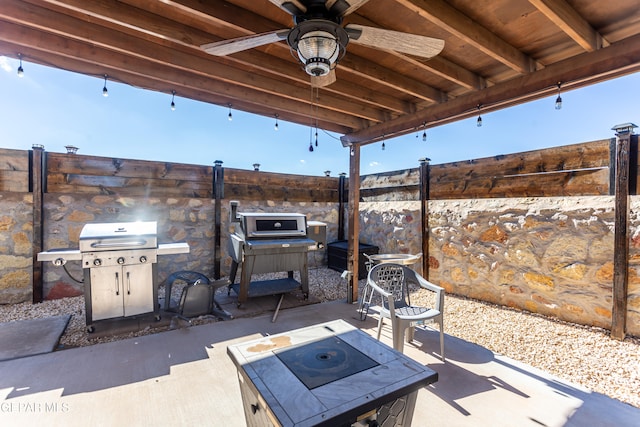 view of patio with grilling area and ceiling fan