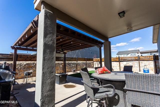 view of patio / terrace featuring ceiling fan