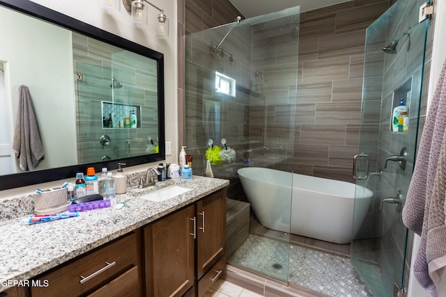 bathroom featuring vanity and separate shower and tub