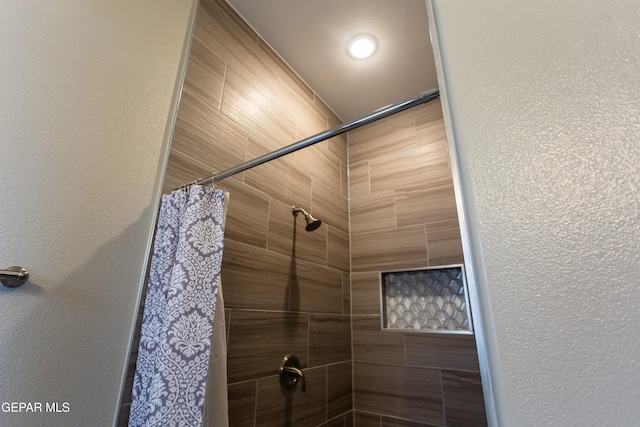 bathroom featuring a shower with curtain