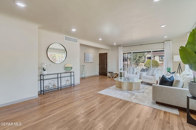 living room with light hardwood / wood-style floors