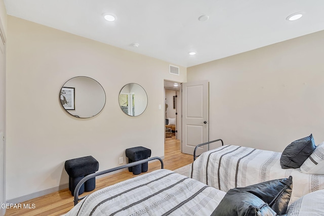 bedroom with light hardwood / wood-style flooring