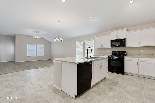 kitchen featuring black appliances, sink, an island with sink, vaulted ceiling, and white cabinets