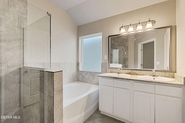 bathroom featuring tile patterned flooring, vanity, shower with separate bathtub, and lofted ceiling