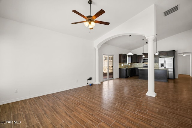 unfurnished living room featuring ceiling fan, dark hardwood / wood-style floors, and high vaulted ceiling